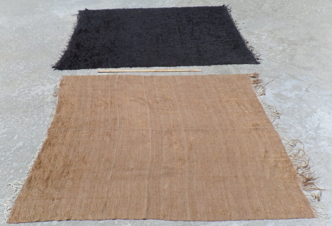 Two Antique Navajo Weavers Rugs: Great items made of handmade wool. These items appear to date from the 1900's. The tan rug measures 69x49 inches and the black rug is 72x49 inches. Items are good with some fringe loss. Shipping: $24.