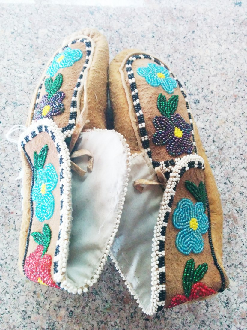 Cree Beaded Moccasins: Cree Beaded Moccasins circa 1920. Made of moose hide and cloth. Items measure about 9" x 4" x 3". From Central Canada. Nice moccs with floral pattern, medium size. Condition: Good condition never been