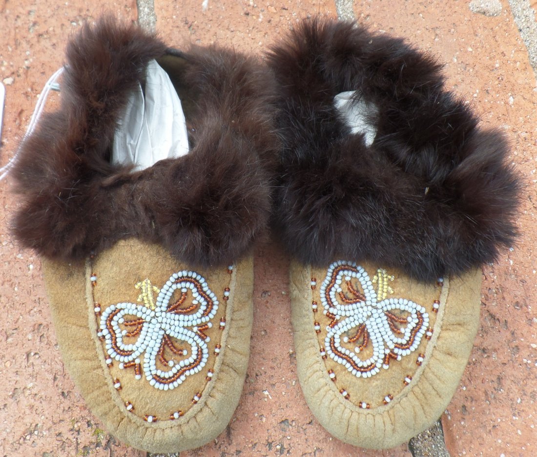 Pair of Beaded Moccasins: Pair of Beaded Moccasins, circa 1920s. Made of glass beads, fur and moosehide. Each mocc. measures approx. 8" x 4" x 2.5". Nice pair of beaded child's moccs. Probably Cree Indian, Canada. Condition: G