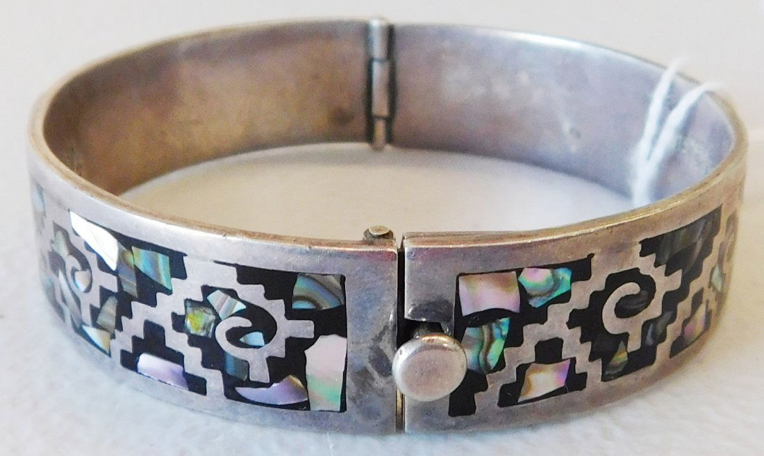 Signed Taxco Sterling Silver & Abalone Cuff: Signed Taxco Sterling Silver & Abalone Cuff. C. 1940s. Made of sterling silver, abalone and possibly jet inlay. Outside measurement is 8.5", inside measurement is about 7". Dimensions are 2.5" x 2.5"
