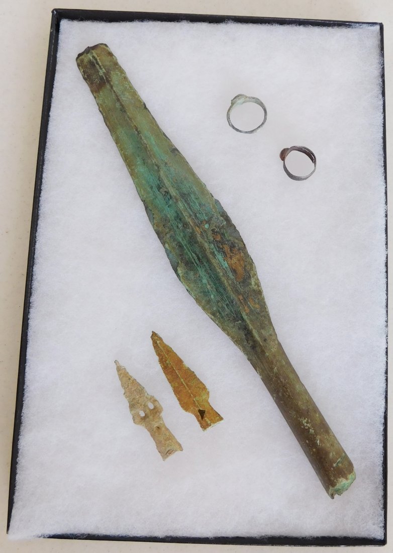 Collection of Bronze Age Artifacts: Collection of Bronze Age Artifacts, circa 3000 years old. Made of bronze. Items include 2-1" rings and a 12" spear, including smaller brass spear points. From Luristan - Persia. Frame is not included.