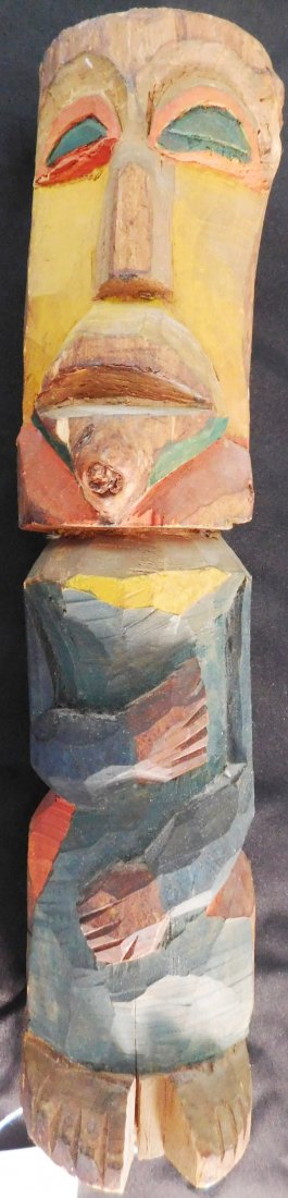 Northwest Coast Totem: Northwest Coast Totem, circa 1910. Made of wood and paint and measuring 18" tall with a circumference of 13". NWC. Fine polychrome carving has a natural knot in the wood which was formed into a tongue