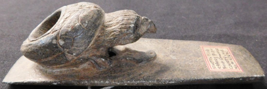 Steatite Hopewell Pipe: This pipe is estimated to be early historic. The Hopewell pipe made of steatite measures 5 1/2 x 1 1/2 x 2 inches. There are minor nicks and scratches. The item may be from Greenup County, Kentucky. P