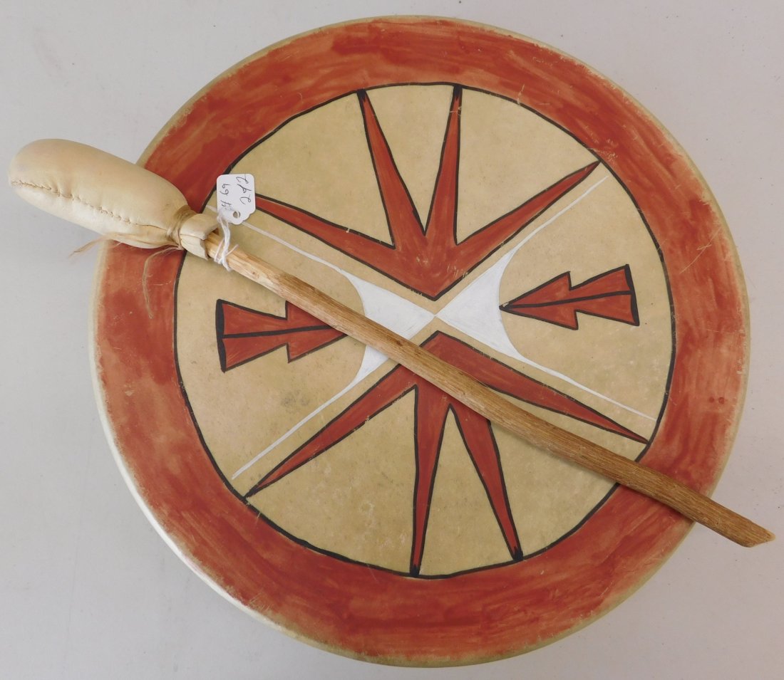 Plains Rawhide Drum and Beater: Plains Rawhide Drum and Beater, mid-20th century item. This Rawhide drum and beater is made from wood, rawhide, nice paint, and a metal ring. The drum is 14 x 3 and beater is 16 x 1 1/2 inches. It is 
