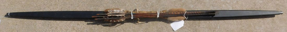 Plains Bow and 3 Arrows: Plains Bow and 3 Arrows, from mid-20th century. Made of wood, leather, feather, fur, steel and paint. The bow is 56 x2 x 1 1/2 inches. Sioux, South Dakota. Condition: Good condition, see images. Shipp