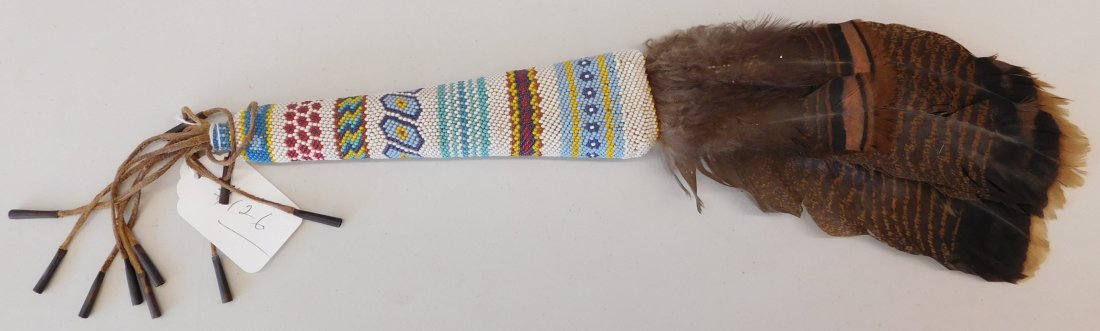 Oklahoma Beaded Dance Fan: Oklahoma Beaded Dance Fan, circa mid-20th century. Made of glass beads and turkey feathers, this item measures 24" x 4". From Oklahoma, Plains Indian. Nice colorful fan. Condition: Very good, see imag