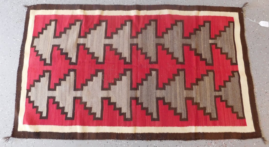 Navajo Weaving: Navajo Weaving, Ganado-type circa 1930s. Item is made of wool and measures 61" x 35". Has red, black, grey, white and brown. Navajo, Arizona. Condition: Minor edge and moth damage, see images. Shippin