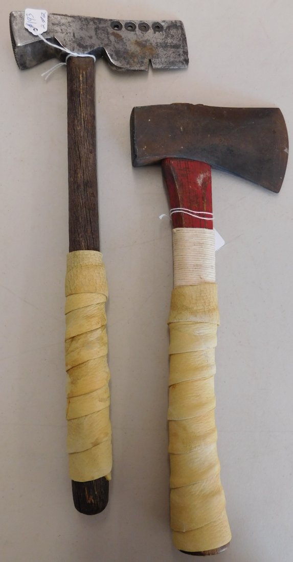 2 Antique Trade Axes: 2 Antique Trade Axes, circa early 20th century. Made of wood, leather and steel, they measure 14" x 5", and 16.5" x 6". From North Dakota. 1 axe is a Truetemper tomahawk, the other is Plumb shingle ha