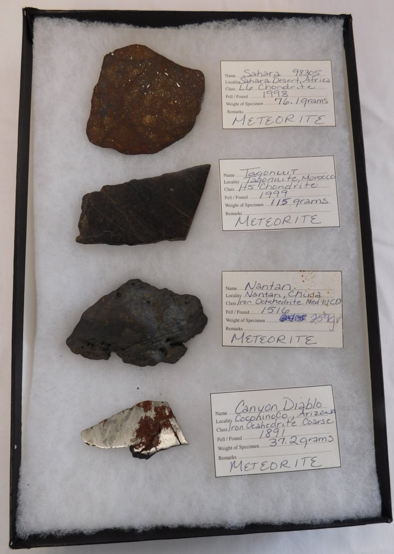 Collection of Meteorite Display: Great display of prehistoric meteorites measuring 2 to 3 inches. Data is available on each of the items. Weights are notated. Frame is not included. Shipping: $18.00 These items came from long time co