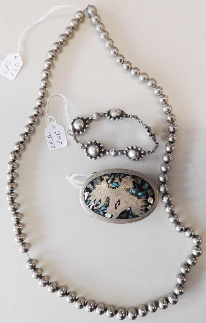 Collection of Old Mexican Jewelry: Collection of Old Mexican Jewelry, circa 1940s. Made of silver, copper, abalone and jet or onyx. The necklace measures 30", the bracelet is 7" long, and the buckle is 2.75" long. From central Mexico. 