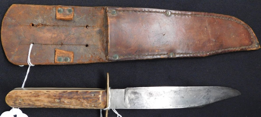 Civil War Bowie Knife: Civil War Bowie Knife, circa 1860s. Made of leather, antler and steel. The case measures 12" x 2.5", the knife measures 11" x 2.5" x 1" with a 4" handle. From the southern USA. Classic antler handle, 