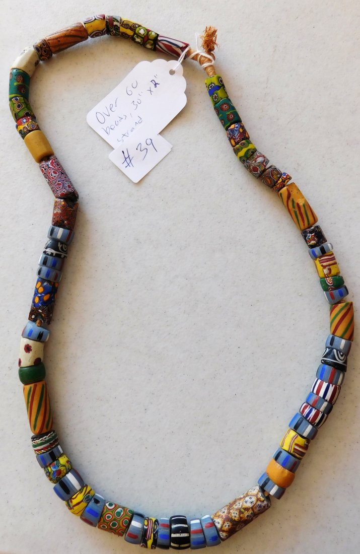 Antique Millefiori Trade Beads: Antique Millefiori Trade Beads, circa 18th century. Made of glass, this strand is 30" long, individual beads are about 1" x 0.5". Traded from Italy to Africa. Wide variety of old trade beads! Conditio