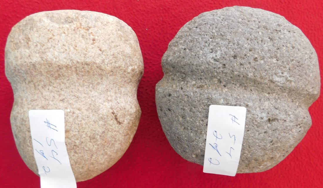 Pair of South Dakota Stone Mauls: Pair of South Dakota Stone Mauls, pre-historic items. Made of granite, items measure 5" x 5" and 4.5" x 4.5". Sioux, Deadwood, South Dakota. Full grooved mauls. Condition: 1 has bit chips, see images.