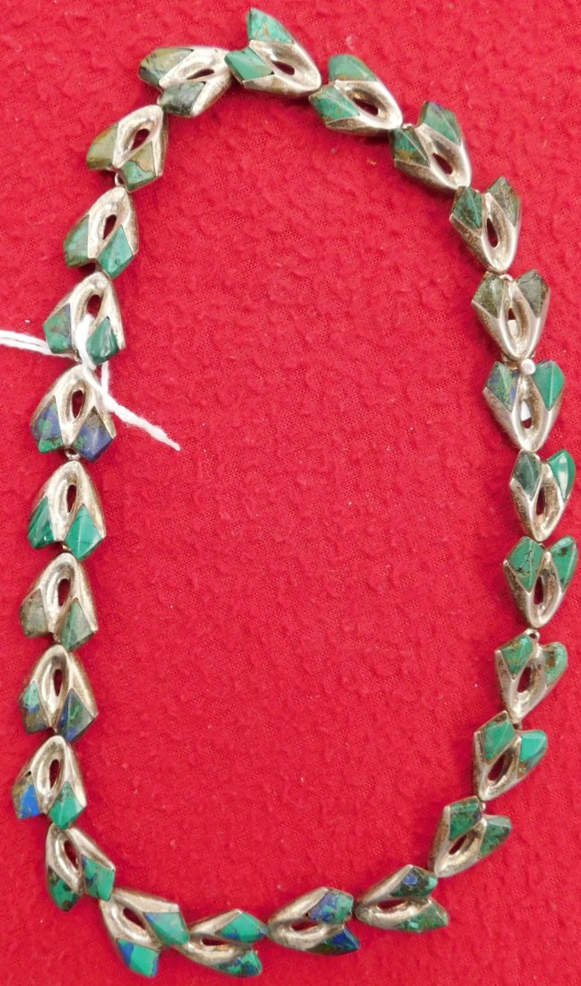 16" Taxco Sterling Choker: 16" Taxco Sterling Choker, circa 1940s. Made of sterling silver, turquoise, and possibly lapis, the necklace is 16" long x 0.5". Mexico, Taxco. 23 links excluding clasp pieces, could be redesigned int
