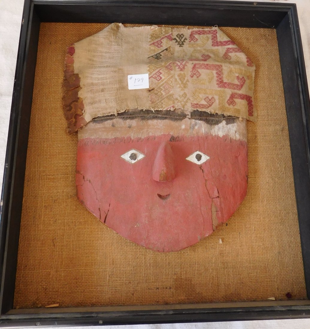 Pre-Columbian Mask: Pre-Columbian Mask, circa 1000 plus years old. Made of wood, paint and textile. Item measures 14" x 11" x 4". From Bolivia. Frame is 18" x 8" x 3" and is included. Condition: Normal wear, see images. 