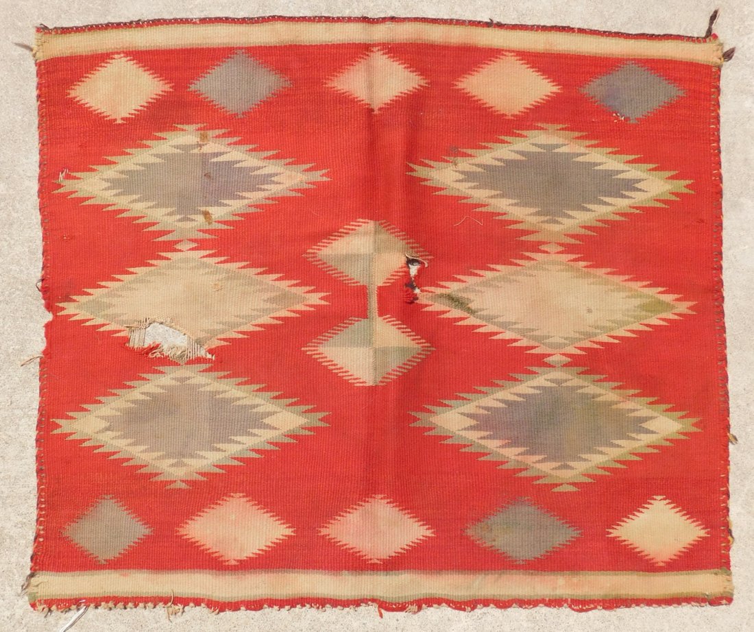Germantown Navajo Weaving: Germantown Navajo Weaving, circa 1880s. Made of wool and measuring 30" x 26". From New Mexico. Classic old germantown rug. Condition: Has holes and stains, needs repair, see images. Shipping: $25.00.