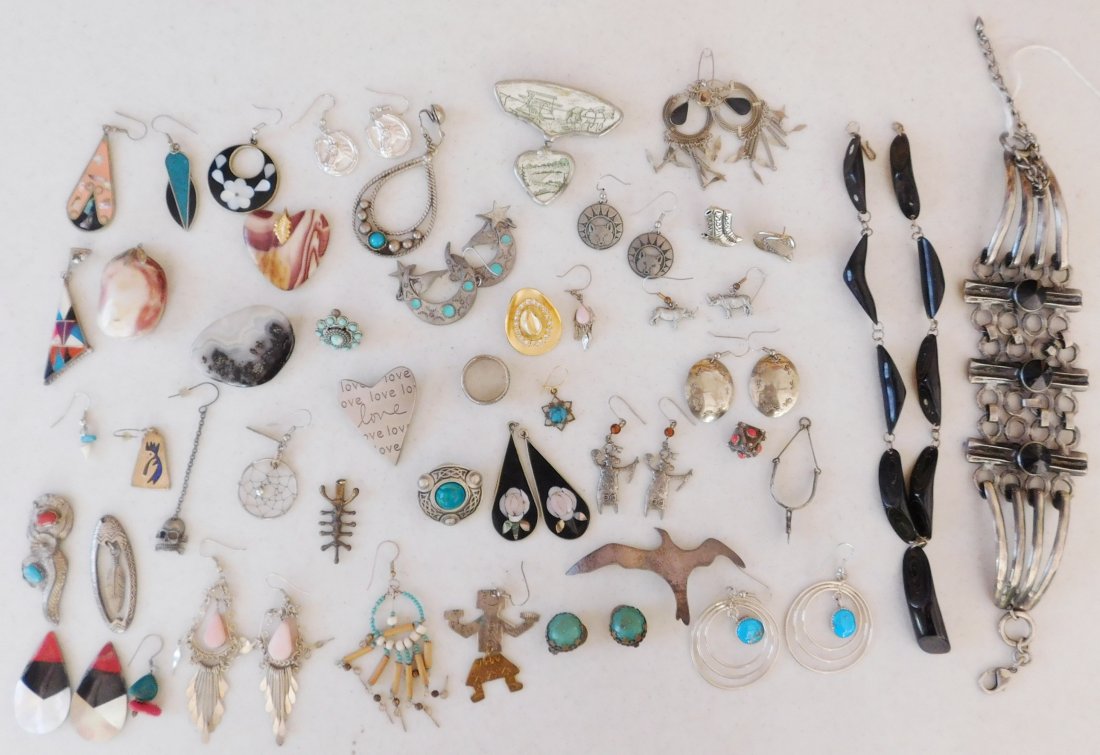 Assorted Jewelry Lot: Assorted Jewelry Lot, 20th century items. Made of metal, sterling silver, turquoise, mother of pearl, coral, etc. Items vary in size and origin, many being Native American or Mexican. Lot includes ear