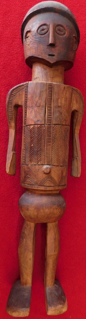 Polynesian Wood Sculpture: Polynesian Wood Sculpture, circa 1930s. Made of wood, the item measures 4.5" x 3.5" x 17" tall. Polynesia, island unknown. Fine engraving throughout. Condition: Good, nice patina, see images. Shipping
