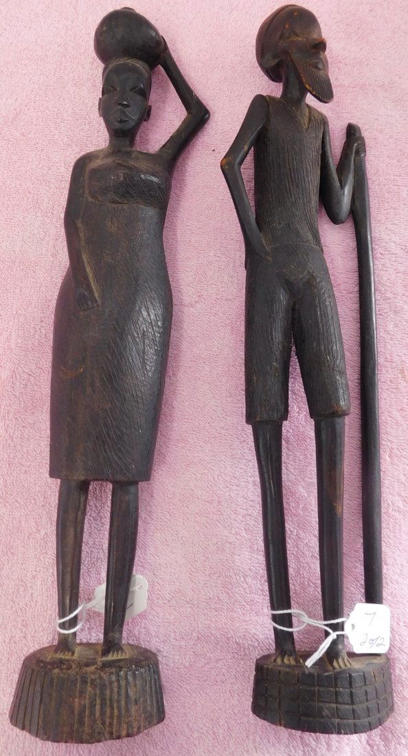 Pair of Ebony African Carvings: Pair of Ebony African Carvings, circa 1950s. Made of ebony wood, the items are 14 and 14.5" tall. From Nigeria. Man & woman carvings, Condition: Good, see images. Shipping: $25.50, due to length, w/in