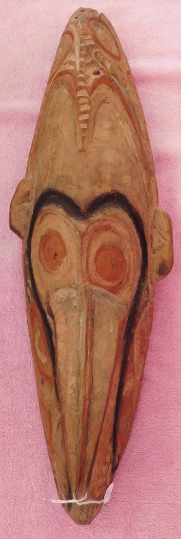 New Guinea Mask w/Helm COA: New Guinea Mask, circa WWII. Made of wood and measuring 7" x 5" x 23", Sepik River. Good, old nicely made authentic mask. Ex. Maslyn Williams, author of Stone Age Island. Helm Certificate of Authentic