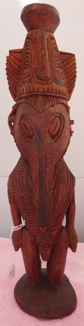 New Guinea Wood Figure w/Helm COA: New Guinea Wood Figure, circa WWII. Made of wood and measuring 4" x 4" x 15.5", Sepik River. Fine carving on front and back. Ex. Maslyn Williams, author of Stone Age Island. Helm Certificate of Authen