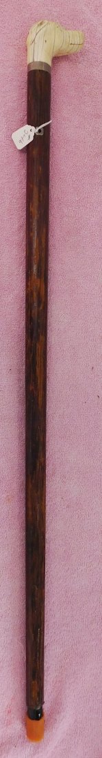 Dog Head Cane: Dog Head Cane, circa 1800s. Made of wood and bone, the item is 32.5" long. Probably from the Northeast Coast, USA. Beautiful carving on this cane. Condition: Wear, age cracks, see images. Shipping: $3