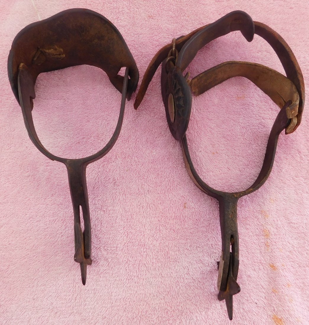 Pair of Old Cowboy Spurs: Pair of Old Cowboy Spurs, circa 1920s. Made of leather, silver and iron, the items measure 10" x 4" x 2.75" and 8" x 4" x 2.75". From Colorado. Condition: Some rust and wear, see images. Shipping: $22