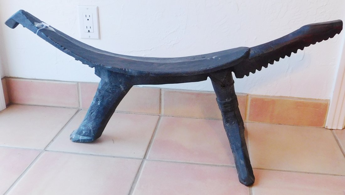 Large Polynesian Coconut Husking Stool w/Helm COA: Large Polynesian Coconut Husking Stool, circa WWII. Made of hardwood and cane ties, the item is 36" long x 13.5" x 17". New Britain. May have been old when it was collected in the 40s. Condition: Blad