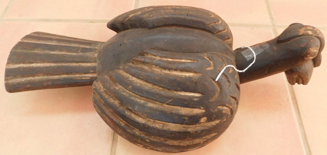 Old African Mask: Old African Mask, early 20th century. Made of wood, the item measures 20" x 10" x 5". Nigeria. Helmet, bird effigy. Condition: Good, see images. Shipping: $32.50 w/insurance and signature, due to leng