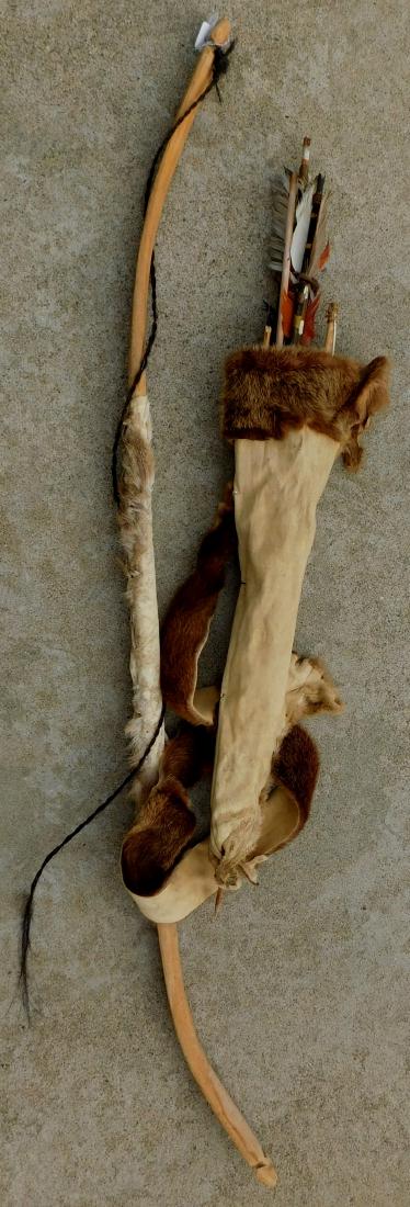 Bow & Arrows w/Quiver: Bow & Arrows w/Quiver, bow is over 100 years old. Lot contains an otterhide quiver and a wood bow with a broken horsehair string. The item measures 50" x 1" x 0.5'. San Diego County, Calif. Various ar