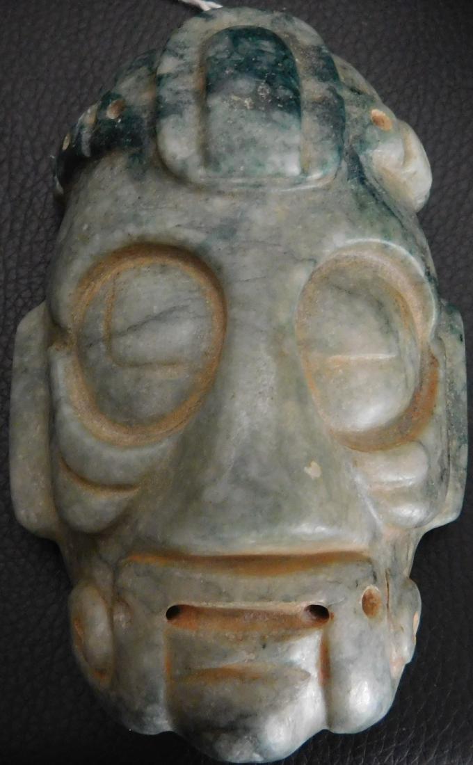 Mayan Jade Mask w/Helm COA: Mayan Jade Mask, circa 2000 years old. Made of green jade, the item is 4" x 2.75" x 1.5". Mayan, Guatemala. Museum quality piece w/investment value. From an old 1960s California collection. With Helm 
