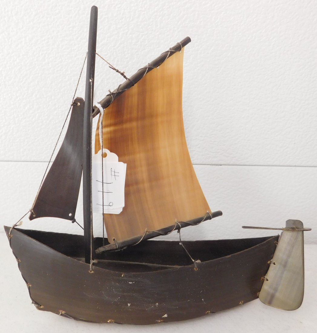 Eskimo Toy Boat: Eskimo Toy Boat, circa 1920s. Made of baleen and horn, the item is 8.5" x 3.75" x 8". Alaska. Boat with sails and rudder! Condition: Good, see images. Shipping: $25.50 double-boxed, w/insurance and si