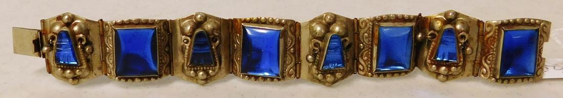Mexican Link Bracelet: Mexican Link Bracelet, circa 1930s. Made of german silver and blue glass, the item is 7" x 1". Mexico. Weighs 43.7 grams. Stamped Hecho En Mexico w/Eagle. Did not test for sterling. Condition: Good, s