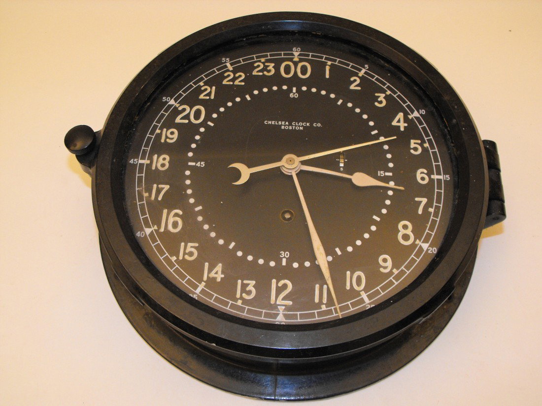 040: Chelsea Clock: Chelsea Navy Clock, 24 hour military time, 10 1/2" across x 2 3/4" deep, works!