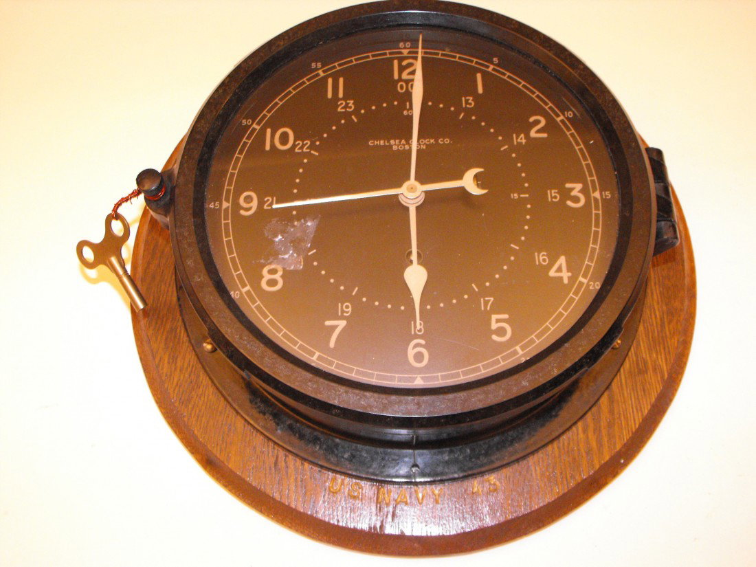 041: Chelsea Clock: Chelsea, Boston, w/ original key, approx 10 1/4" across x 3" deep, works!