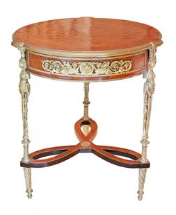 A LOUIS XVI STYLE GILT-METAL GUERIDON: Property from A Palm Beach Breakers Apt A Louis XVI style gilt-metal guéridon 20th century, in the manner of Adam Weisweiler with a circular wood top and three gilt metal legs united by an undertier,