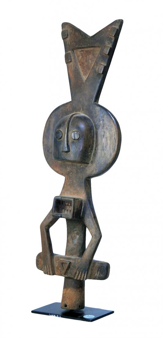 STYLE OF WATER SPIRIT CEREMONIAL DANCE TOTEM HEADDRESS: Property of Lynn University to benefit the Library Renovation Fund To be sold subject to no reserve STYLE OF Water Spirit Ceremonial Dance Totem-Headdress carved wood with rich brown patina in elongat