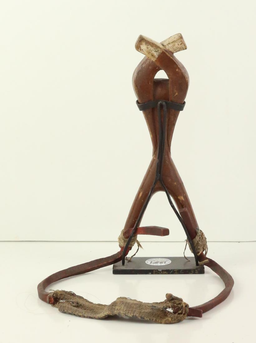 STYLE OF "ZAMBLE" SOCIETY SLINGSHOT - CARVED WOOD: Property of Lynn University to benefit the Library Renovation Fund To be sold subject to no reserve STYLE OF "Zamble" Society Slingshot- carved wood complete slingshot with Zamble Society mask and cro