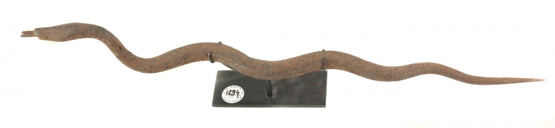 STYLE OF HOGON'S CEREMONIAL SERPENT TOTEM HAND-FORGED: Property of Lynn University to benefit the Library Renovation Fund To be sold subject to no reserve STYLE OF Hogon's Ceremonial Serpent Totem- one of a kind, hand-forged iron with dark brown patina & 