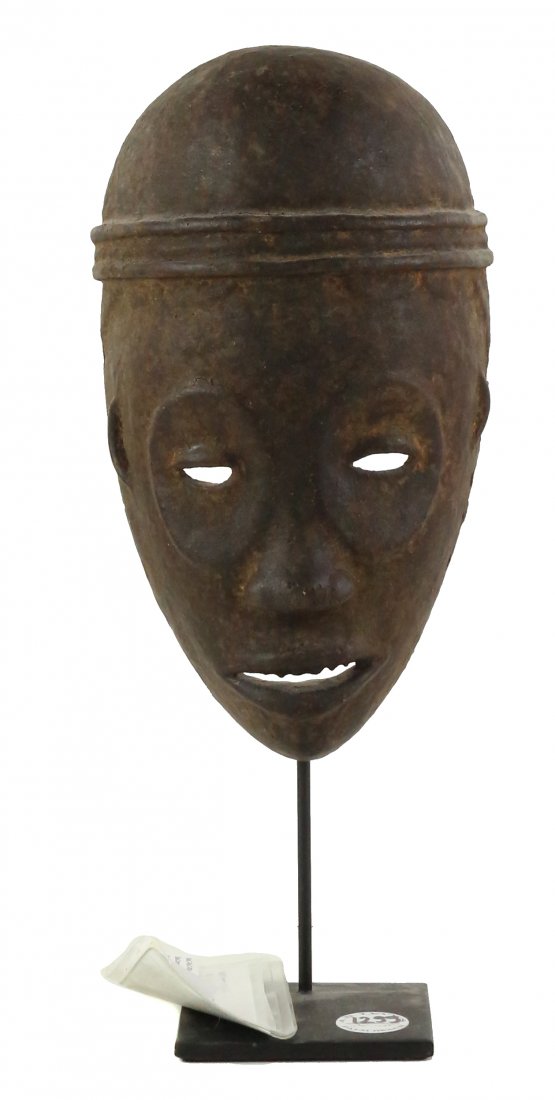 STYLE OF CEREMONIAL DANCE MASK CARVED WOOD: Property of Lynn University to benefit the Library Renovation Fund To be sold subject to no reserve STYLE OF Ceremonial Dance Mask- Full male face of simple form with rounded crown/head, two raised ca