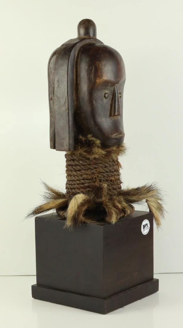 STYLE OF MALE ANCESTRAL TOTEM HEAD - CARVED WOOD: Property of Lynn University to benefit the Library Renovation Fund To be sold subject to no reserve STYLE OF Male Ancestral Totem Head - medium size carved wood with dark brown rich patina of male hea