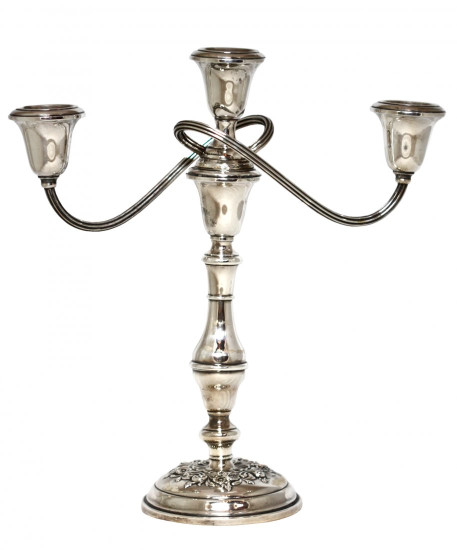 An American Silver Three-Light Candelabra, Gorham: An American Silver Three-Light Candelabra Gorham Mfg. Co., Providence, RI, on a circular lobed base chased with berried foliage rising to a baluster stem with three scrolling branches surmounted by fi