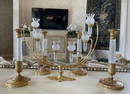 Four Empire Style Gilt Bronze & Cut-Glass Candlesticks & a Candelabra