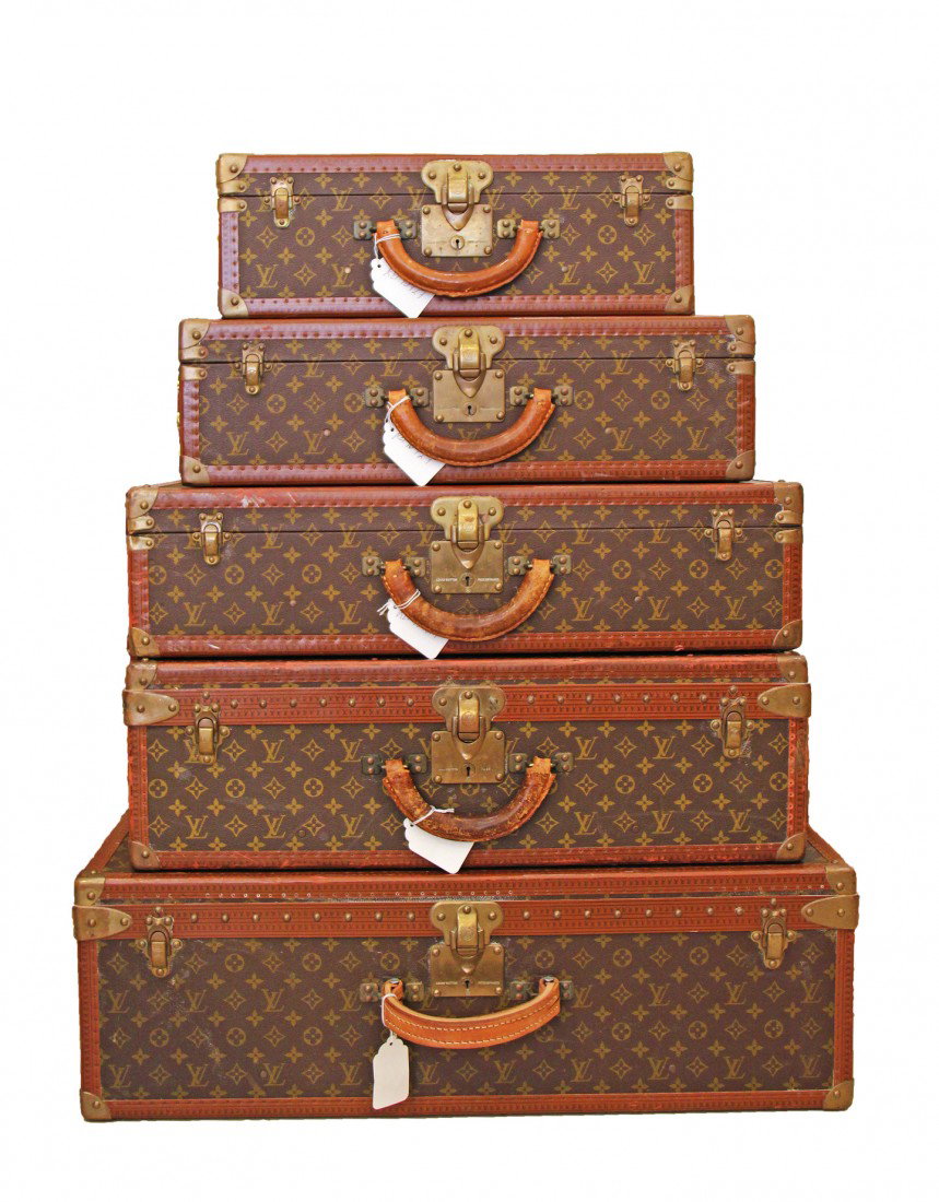 5 (five) Louis Vuitton Hard Back "Alzer" Suitcases: 5 (five)Louis Vuitton Hard Back Suitcases circa 1940 Five classic Alzer suitcases with monogram pattern, leather edging, brass locks, catches, corners and rivets, both with, L.S.R. stenciled in yellow