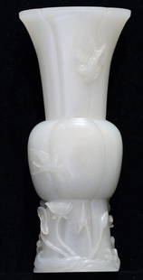 CHINESE CARVED JADE VASE: A CHINESE CARVED JADE VASE Delicately carved with water lilies and birds in relief. Height 7 3/4in. (17cm.) by Width 3in. (8cm.) by Depth 1 1/2in. (3.5cm.)