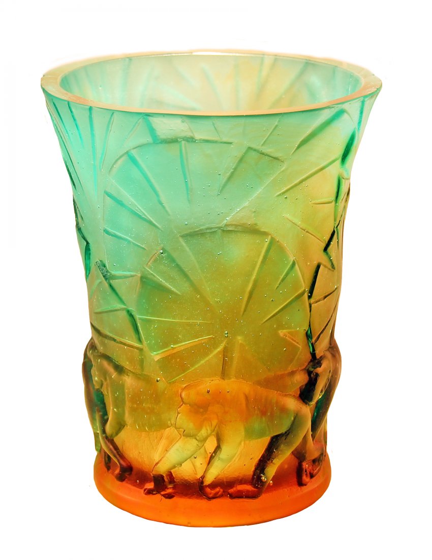 DAUM CRYSTAL " CRYSTAL MONKEY" VASE, FRENCH, MODERN.: Daum Crystal Monkey Vase, the upper body molded with tropical palms in shades of greenish blue, above an amber colored troupe of monkeys, signed Daum France. New in original box. Height 6 in. (15.2cm)