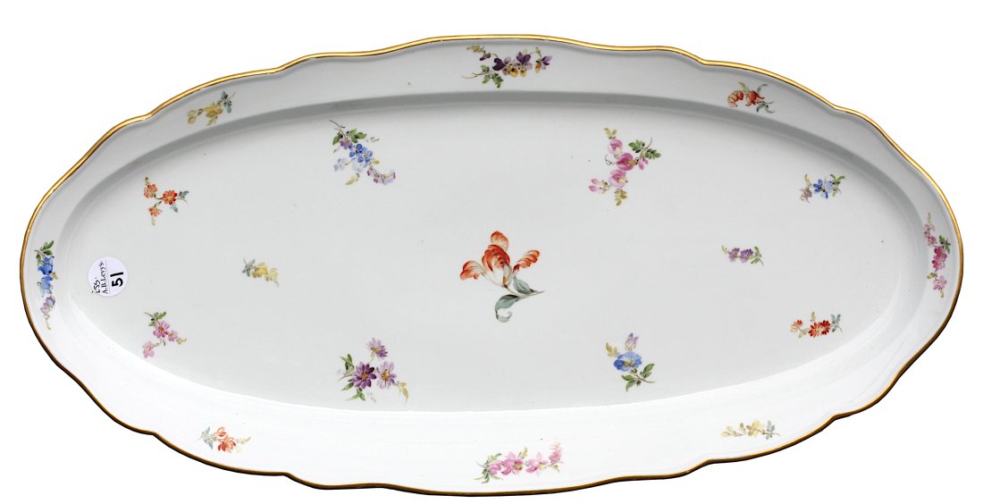 Meissen Porcelain Oval Platter: Meissen Porcelain Oval Platter The underside is marked with crossed swords in underglaze blue. Scalloped gilt edge decorated with scattered Deutch blumen, Length 24 in., Depth 12 in.