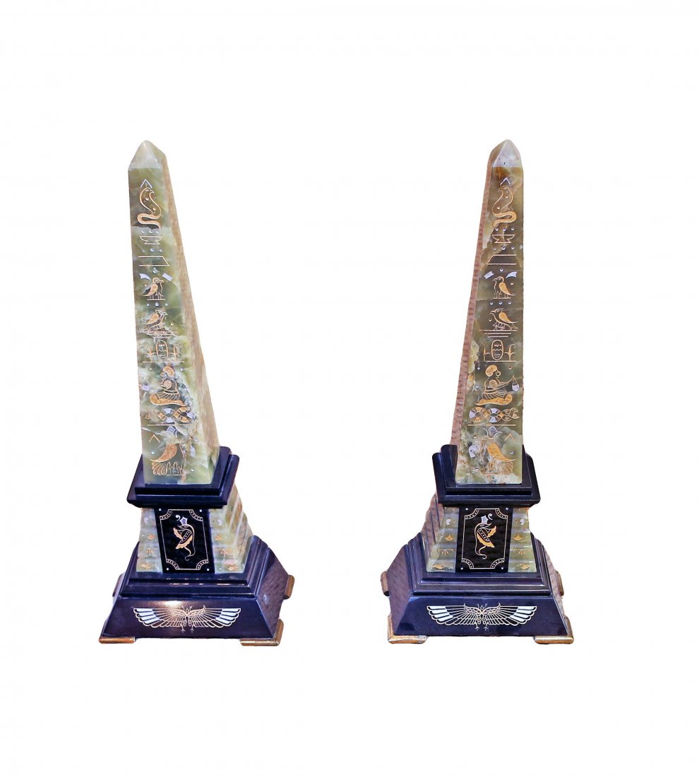 PAIR OF EGYPTIAN REVIVAL ONYX AND MARBLE OBELISKS: PAIR OF EGYPTIAN REVIVAL ONYX AND MARBLE OBELISKS 19th Century. Each carved and decorated with gilt and raised on a rectangular stepped base. Height 20 1/2 inches.