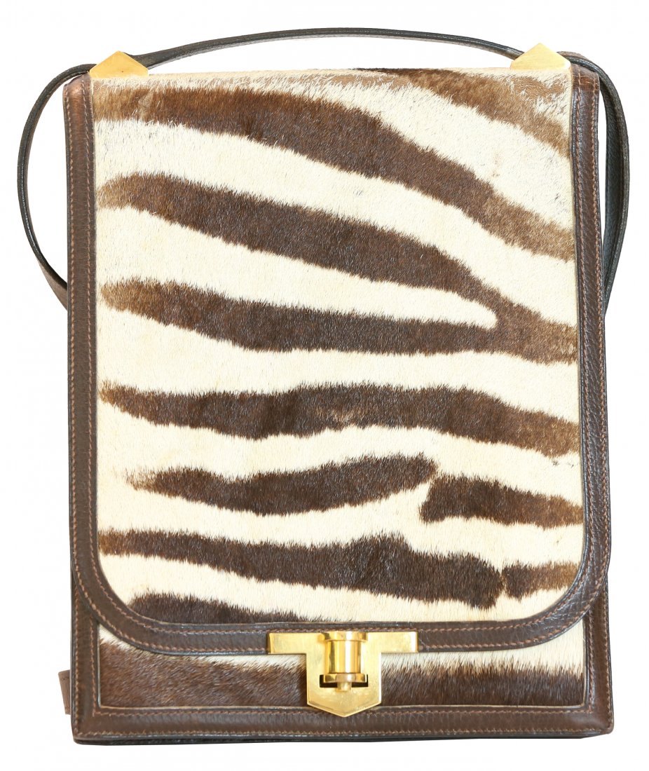 HERMES LEATHER AND ZEBRA SHOULDER BAG: PROPERTY OF A PALM BEACH LADY: HERMES LEATHER AND ZEBRA SHOULDER BAG Hardware stamped Hermes Paris. Length 7 1/2 Height 9 inches.