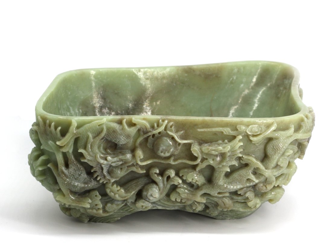 Chinese Carved Green Soapstone Basin: Chinese Carved Green Soapstone Basin The mottled pale green quadrangular bowl carved with dragons on both the interior and exterior. Height 6 in., Width 13 in., Depth 11 in.